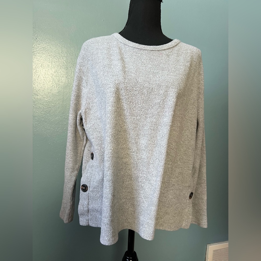 Grey crew neck sweater with buttons on side
